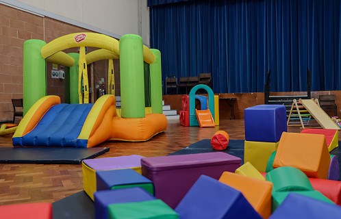 large hall with soft play equipment and toys